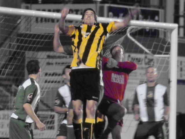 Mikel Suarez goes up for a cross