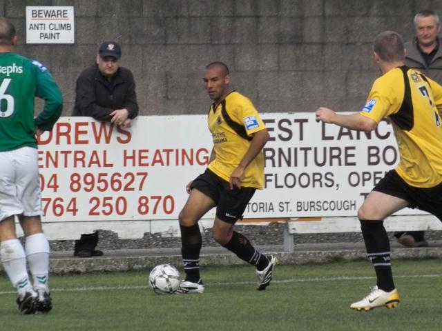 Ashley Nicholls measures his pass