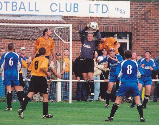 Town's keeper Simon Ward collects well