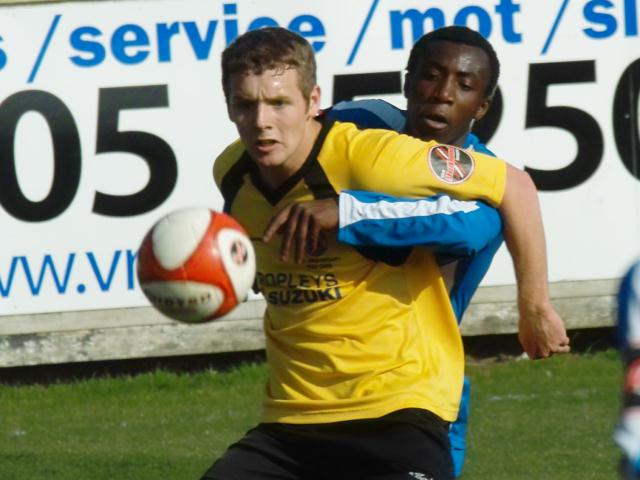 Alex Beck is tightly marked