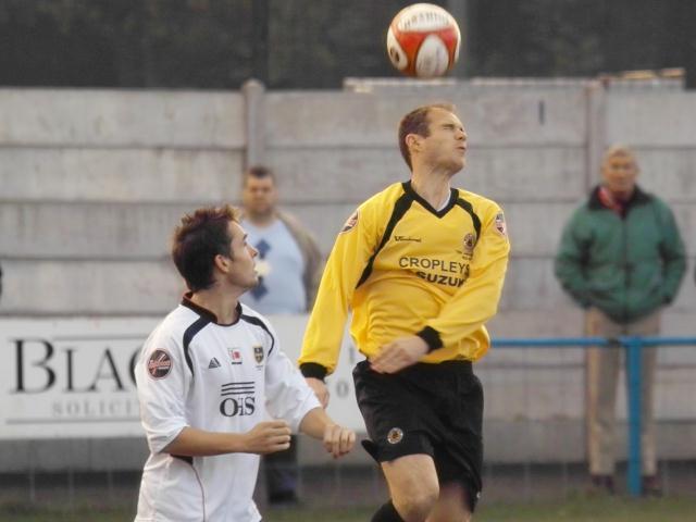 Steve Melon heads clear