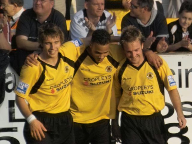 Thompson, Leabon and Green celebrate after Boston's 4th goal