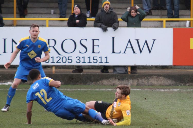 Brad Abbott fouled by Magunda