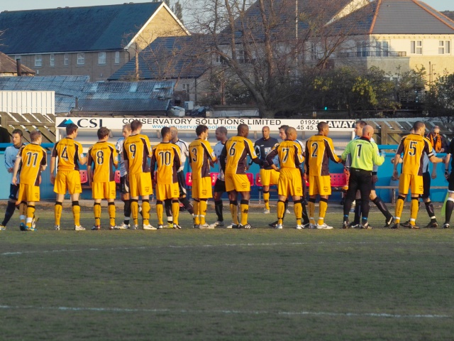 The teams parade in front of empty section