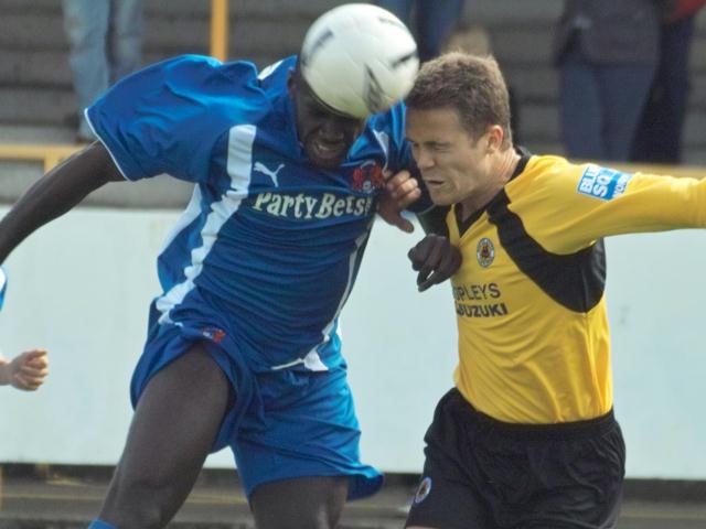 Ryan Clarke makes an aerial challenge