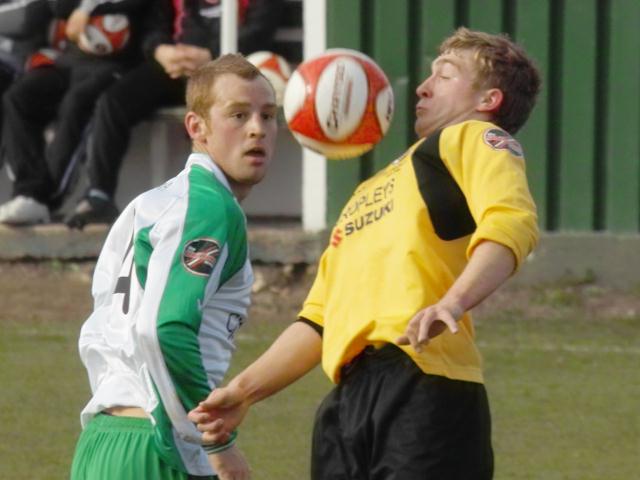 Adam Millson chests the ball