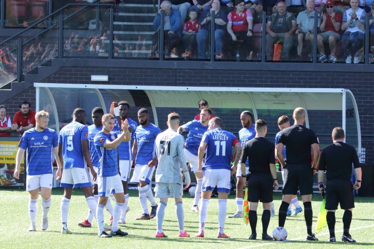 The team is out in their blue away kit