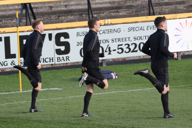 The officials warm up