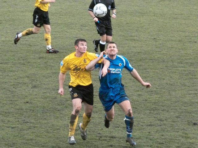 Talbot battles for the ball